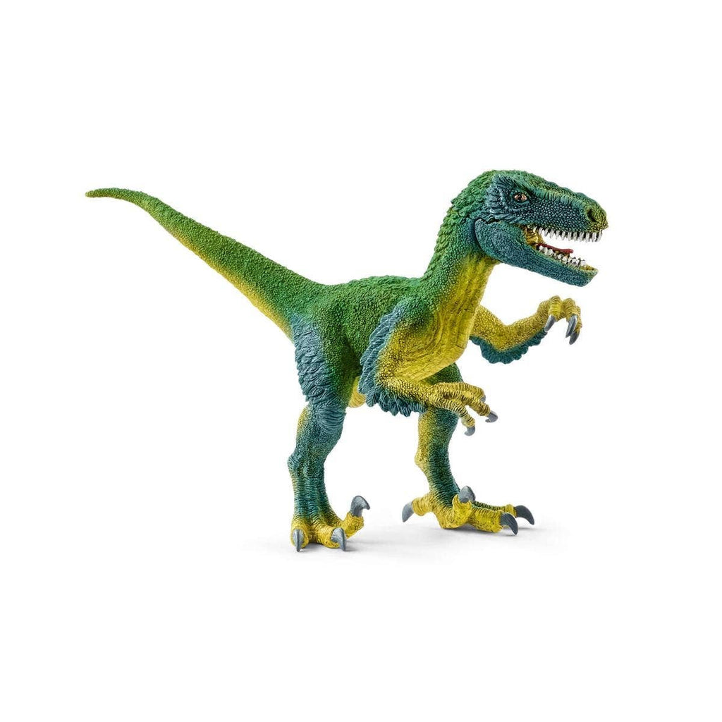 The Schleich Velociraptor Dinosaur Toy features a green and yellow dinosaur standing on two legs with its mouth open, teeth visible, and claws raised, closely resembling a Velociraptor. This educational figurine makes an excellent addition to any Schleich toy collection.