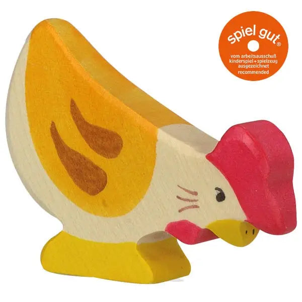 A Holztiger Hen, Pecking painted in yellow, orange, red, and white. The handcrafted wood hen features simplistic details including wings, eyes, and a beak. An orange round sticker in the top right corner reads "spiel gut." Like HOLZTIGER figures, this piece is made in Europe with care and skill.