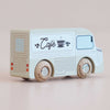No. 11 GT65 Coco | Made in England—a wooden coffee van painted white and blue with “Café” and a cup design on its side, featuring wooden wheels and simple line details, set against a plain light background—perfect for imaginative storytelling or thoughtful gifting.