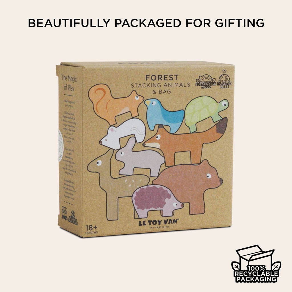 A cardboard box labeled "Woodland Stacking Forest Animals & Bag" is adorned with vibrant illustrations of woodland creatures from this charming stacking set. The text states "Beautifully packaged for gifting" and "100% recyclable packaging." This eco-friendly toy, featuring wooden animal blocks, is suitable for children aged 18 months and up.