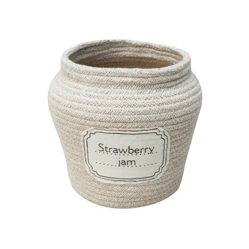 A textured ceramic jar labeled "Strawberry Jam Jar Basket" with a woven appearance, standing isolated on a white background.