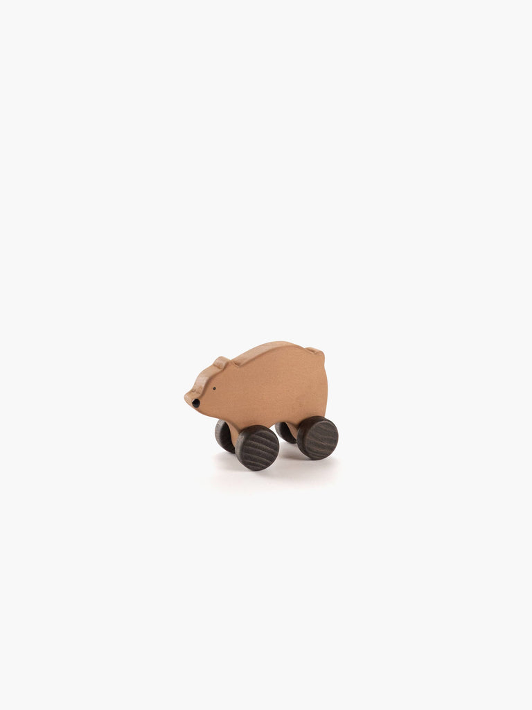 The Sabo Concept Wooden Rolling Brown Bear features four dark wheels and a brown wooden finish, making it perfect for Montessori play, shown against a plain white background.