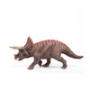 The Schleich Triceratops Dinosaur Toy features brown, textured skin with striking red markings on its back and stands against a white background. Perfect for both collectors and children, this educational figurine captures the lifelike details that are characteristic of Schleich dinosaurs.