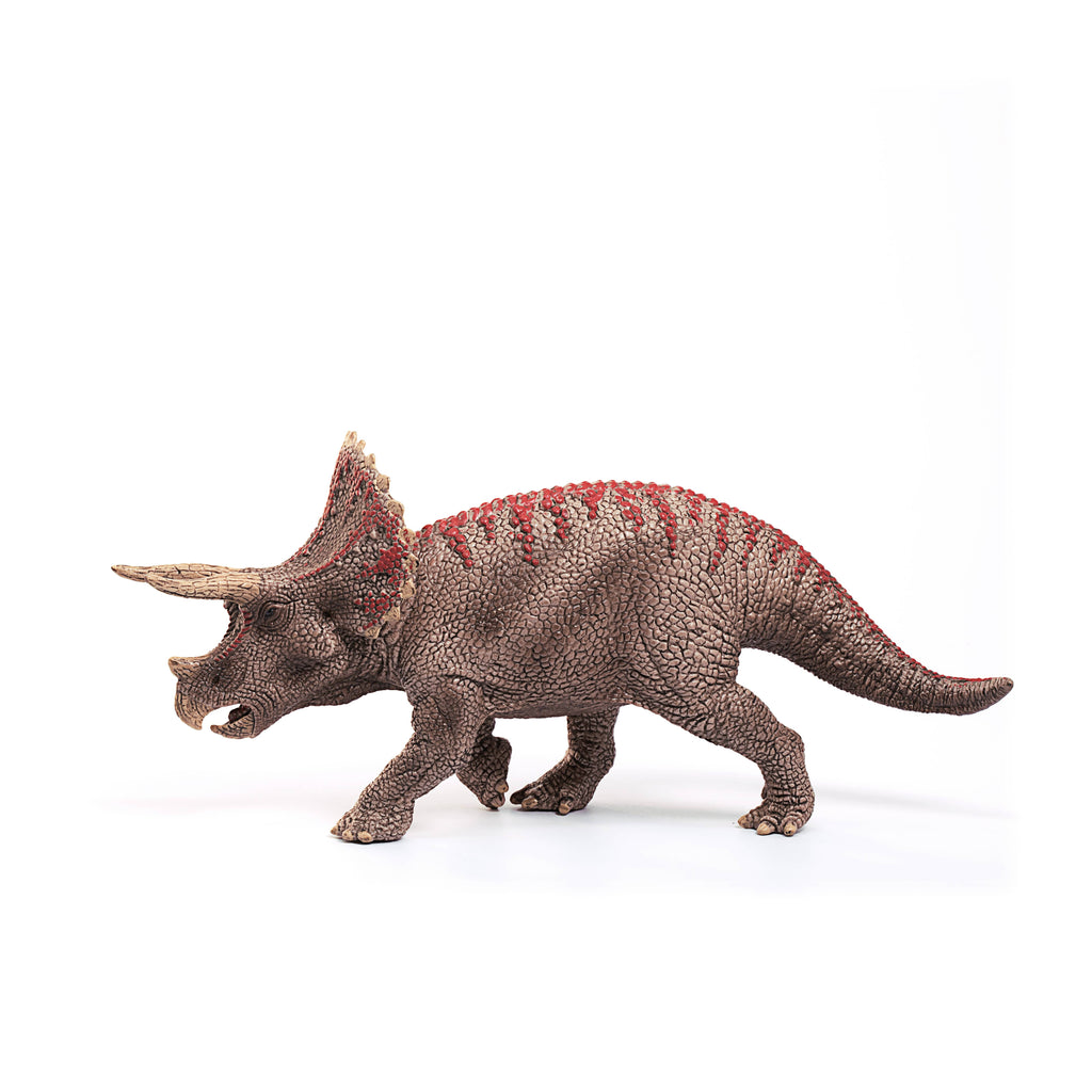 The Schleich Triceratops Dinosaur Toy features brown, textured skin with striking red markings on its back and stands against a white background. Perfect for both collectors and children, this educational figurine captures the lifelike details that are characteristic of Schleich dinosaurs.