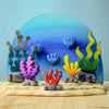 The Bumbu Handmade Wooden Deep Ocean Water Set features vibrant coral and seaweed on a blue gradient, perfect for creating magical underwater scenes with wooden sea life toys.