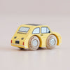 A classic miniature yellow toy car, marked with “No. 10 GT60 Fifi | Made in England,” featuring wooden wheels, is placed on a light surface, facing away and slightly to the right.