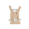 A peach-colored Olli Ella x Odin Parker Dinkum Dolls Cottontail Carrier – Hopscotch with a fluffy white pom-pom, zigzag stripe design, and adjustable shoulder straps from Olli Ella x Odin Parker, displayed on a plain black background.