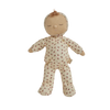 Dressed in a cream-colored onesie with a delicate floral pattern, closed eyes, and a small tuft of brown hair, the Olli Ella Dozy Dinkum - Custard Sweetheart doll makes a charming gift for newborns.