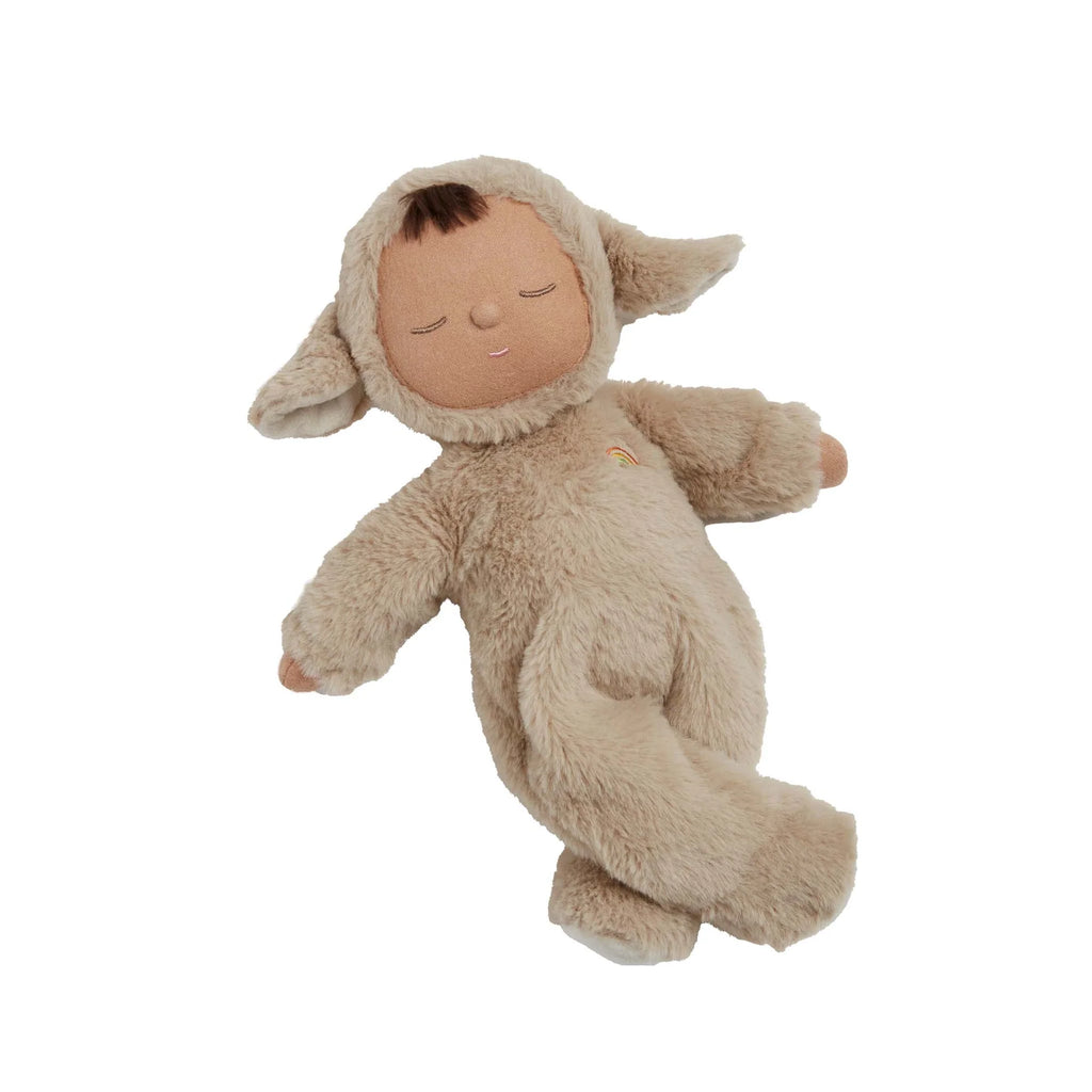 The Olli Ella Cozy Dinkum Doll - Lamby Pip is a cuddly doll in a soft light brown sheep costume with floppy ears, embroidered eyes, a rainbow patch on the chest, and a peaceful sleeping expression.