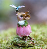 The Wee Forest Folk Tiny Collectible - Pretty Perch in Pink (Not a Toy) features a hand-sculpted mouse in a pink flower dress on moss, gazing at a dragonfly perched on its nose, set against a softly blurred natural background.