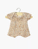 The Minikane 11" Doll Clothing Shorty Bodysuit in Ribbed Knit - Cocoa Flowers features soft, ribbed cotton with an earthy floral print and short sleeves, made in France and shown on a wooden hanger against a white background.