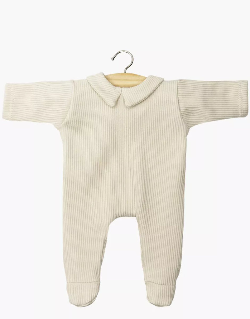 The Minikane 11" Doll Clothing | Sleep Well Corentin Onesie in Ribbed Knit - Linen is a cream ribbed cotton knit onesie with long sleeves, footed legs, and Peter Pan collar, shown on a wooden hanger against a white background. Made in France.
