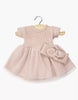 The Minikane 11" Doll Clothing | Rosana Short-Sleeved Tutu and Headband in Petal Pink features a ribbed bodice, tulle skirt, and matching headband—perfect for Minikane dolls. Displayed on a wooden hanger against a white background.