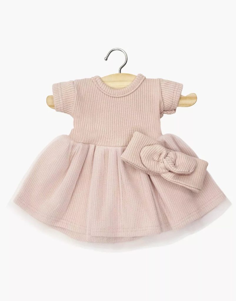 The Minikane 11" Doll Clothing | Rosana Short-Sleeved Tutu and Headband in Petal Pink features a ribbed bodice, tulle skirt, and matching headband—perfect for Minikane dolls. Displayed on a wooden hanger against a white background.