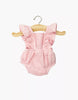 The Lou Retro Romper in Strawberry, made from cotton gauze, fits Minikane 13" dolls. This pink romper features ruffled straps and is shown hanging on a wooden hanger against a white background.