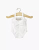 A Minikane 13" Doll Clothing Anna Leotard in shiny white Lycra hangs sleeveless on a wooden hanger against a plain white background.
