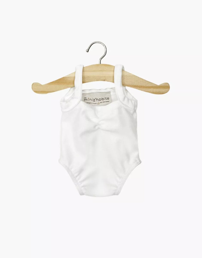 A Minikane 13" Doll Clothing Anna Leotard in shiny white Lycra hangs sleeveless on a wooden hanger against a plain white background.