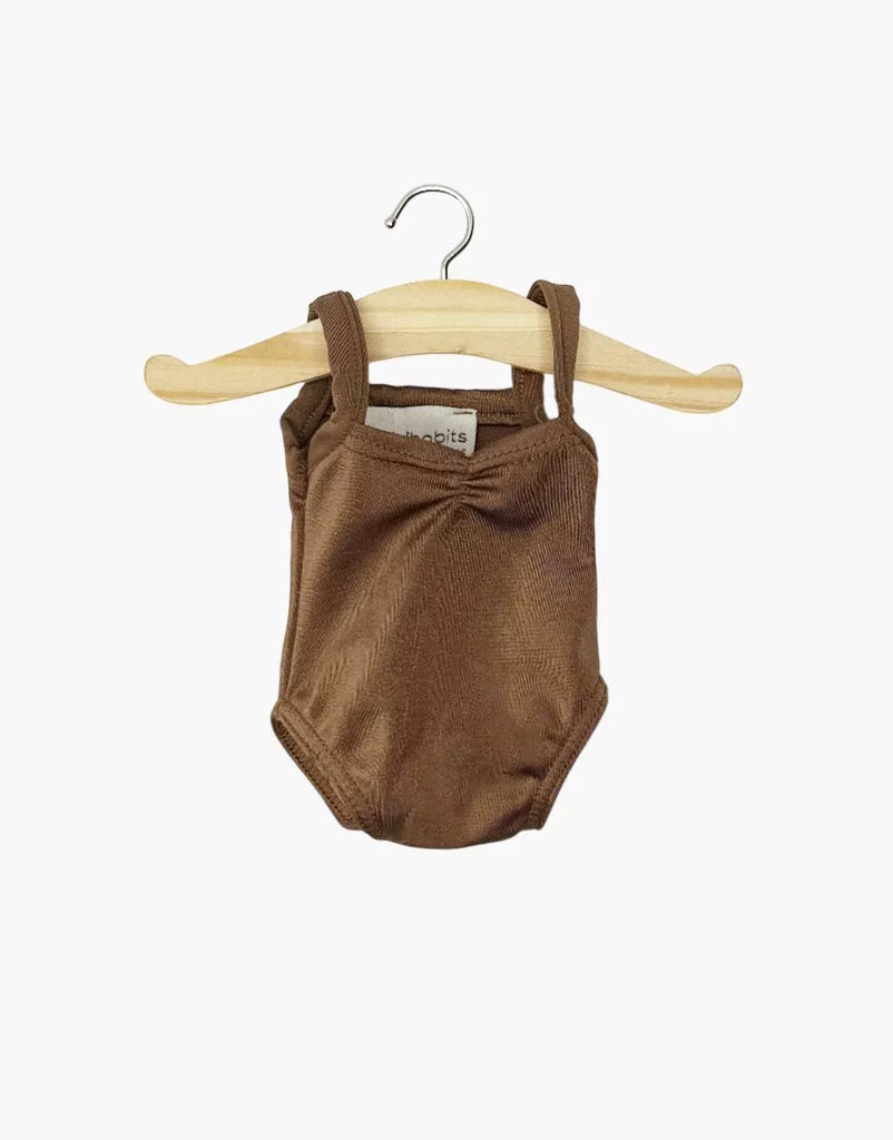 The Minikane 13" Doll Clothing Anna Leotard in Shiny Lycra, Chocolate Brown, is shown on a wooden hanger against a plain white background.
