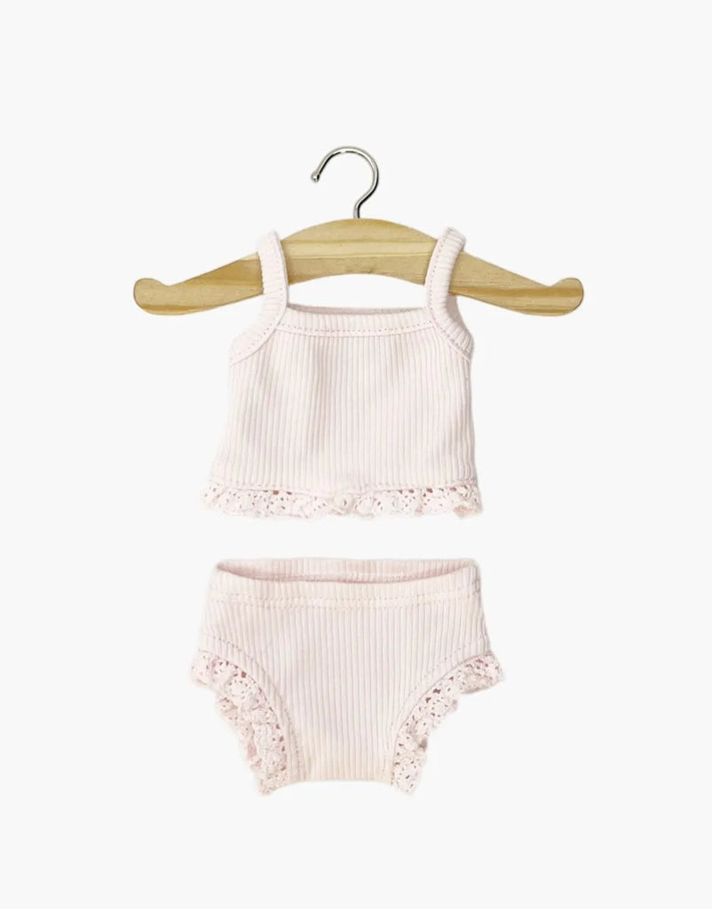 Minikane 13″ Doll Clothing | 2-Piece Set in Ribbed Cotton - Pastel Pink tank top and briefs trimmed with lace and displayed on a wooden hanger.