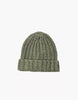 The Minikane Doll Accessories Barry Knit Beanie in green, featuring a folded brim and wool knit, is shown against a plain white background.