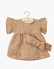 The Minikane Doll Clothing Daisy Dress & Headband in Washed Linen - Hazelnut features a small brown dress with puffed sleeves, fitted waist, and large bow, perfect for 14-inch dolls or Minikane dolls, shown on a wooden hanger.