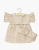 The Minikane Doll Clothing | Daisy Dress & Headband in Washed Linen - Nude is a beige linen dress with short puffed sleeves and a matching bow belt, sized perfectly for Minikane or 14-inch dolls.