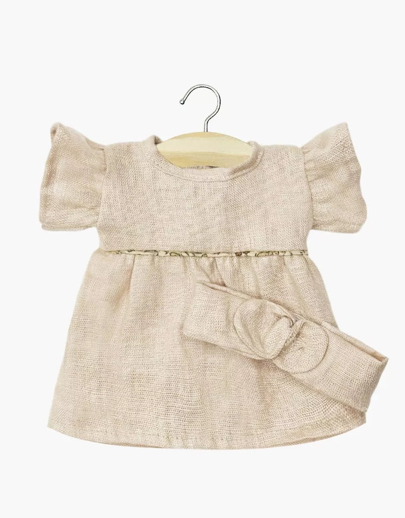 The Minikane Doll Clothing | Daisy Dress & Headband in Washed Linen - Nude is a beige linen dress with short puffed sleeves and a matching bow belt, sized perfectly for Minikane or 14-inch dolls.