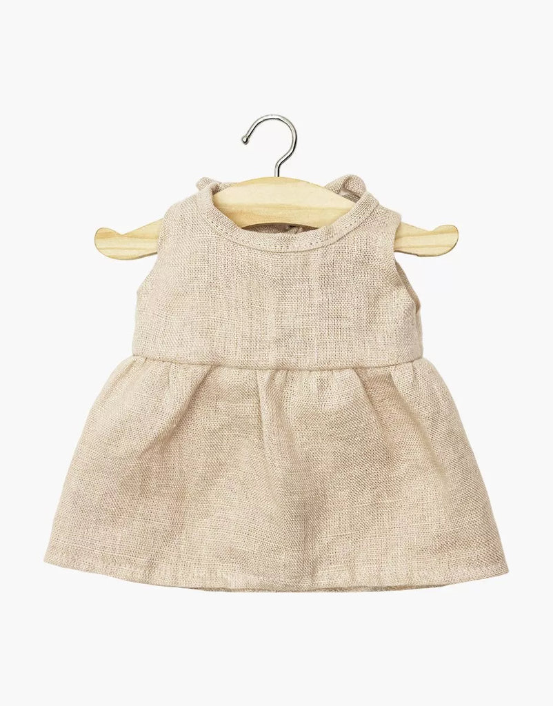 The Minikane 13" Doll Clothing Sleeveless Faustine Dress in Washed Linen - Nude is displayed on a wooden hanger against a white background.