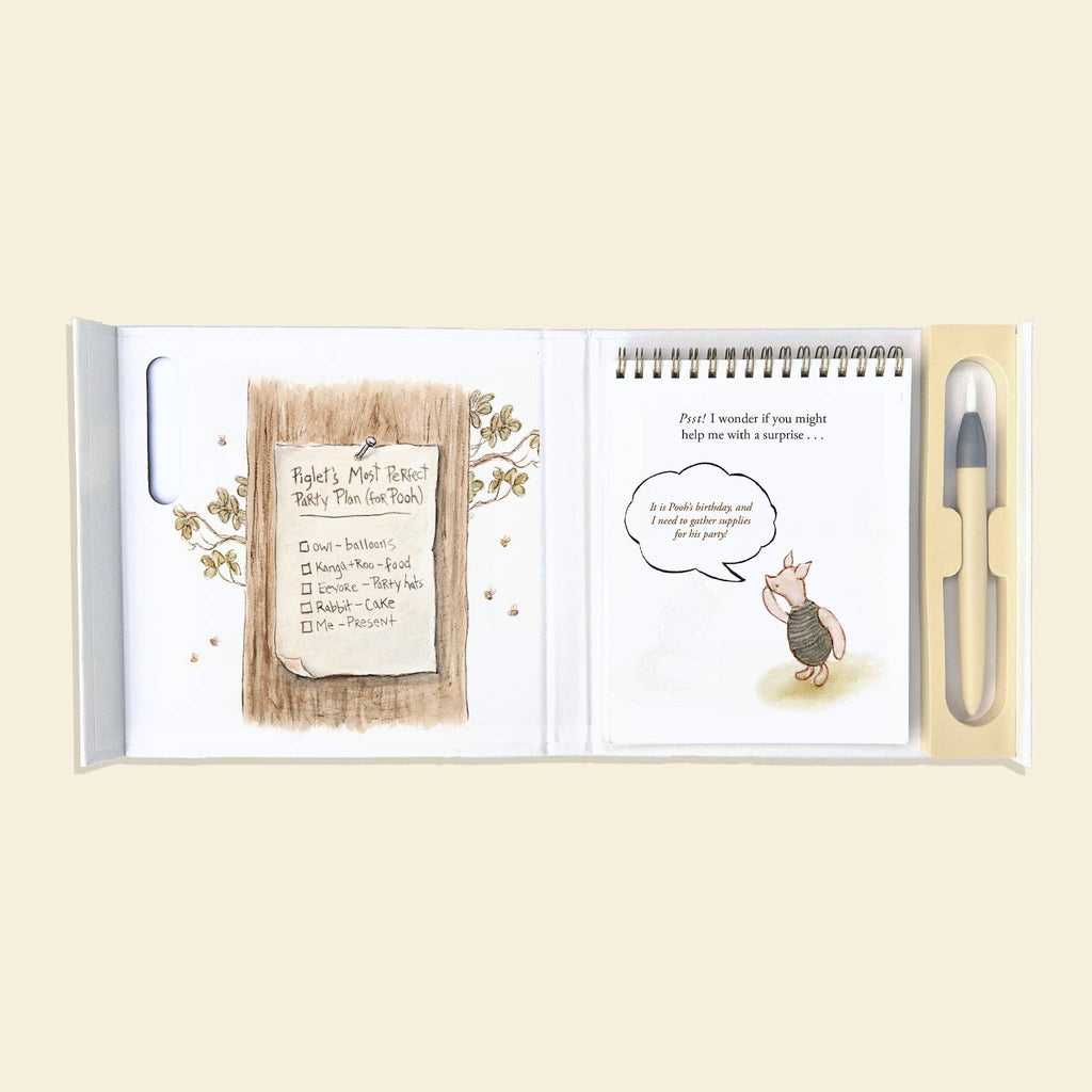 Open Winnie-the-Pooh: Pooh’s Birthday Surprise (Water Reveal) book featuring a handwritten party checklist on the left, an illustrated Piglet with a surprise party prompt on the right, and a refillable water pen.