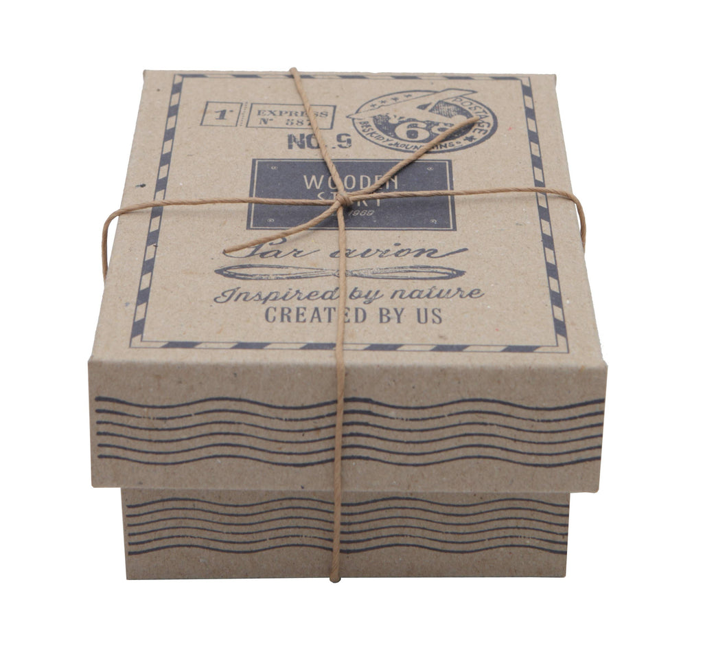 A small, rectangular, brown cardboard box with black vintage-style postal markings and a string—ideal for presenting the eco-friendly Little Wooden French Car baby toy.