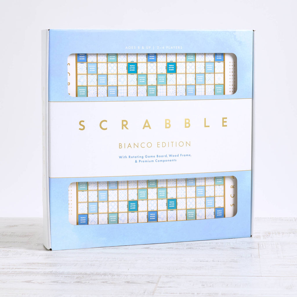Scrabble Bianco Edition board game box featuring a blue and white deluxe game board design with premium lettering and product details printed on the front.