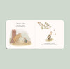 An open Winnie-the-Pooh: Finding Feelings board book shows Pooh and Piglet talking in a forest. Piglet glances down as butterflies flutter by on a light green background, helping toddlers explore emotions.