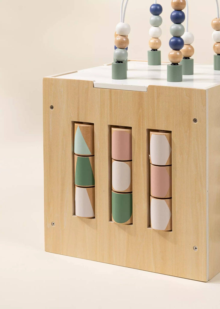 The Wooden Activity Cube features three vertical rows of rotating blocks with pastel geometric shapes and colorful beads on white wires, offering engaging play and helping toddlers develop fine motor skills.