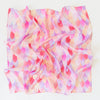 Sarah's Silks Magical Creatures Playsilk - Pink Unicorn is a pure silk square scarf with a crumpled texture and pastel scalloped pattern in pink, purple, peach, and cream—ideal for open-ended play or display on a white surface.