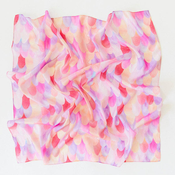 Sarah's Silks Magical Creatures Playsilk - Pink Unicorn is a pure silk square scarf with a crumpled texture and pastel scalloped pattern in pink, purple, peach, and cream—ideal for open-ended play or display on a white surface.