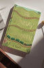 The Railway Children | Collector's Edition | Hardcover features a green cover with illustrated train tracks, a train, and flowers, photographed on a white surface in sunlight.