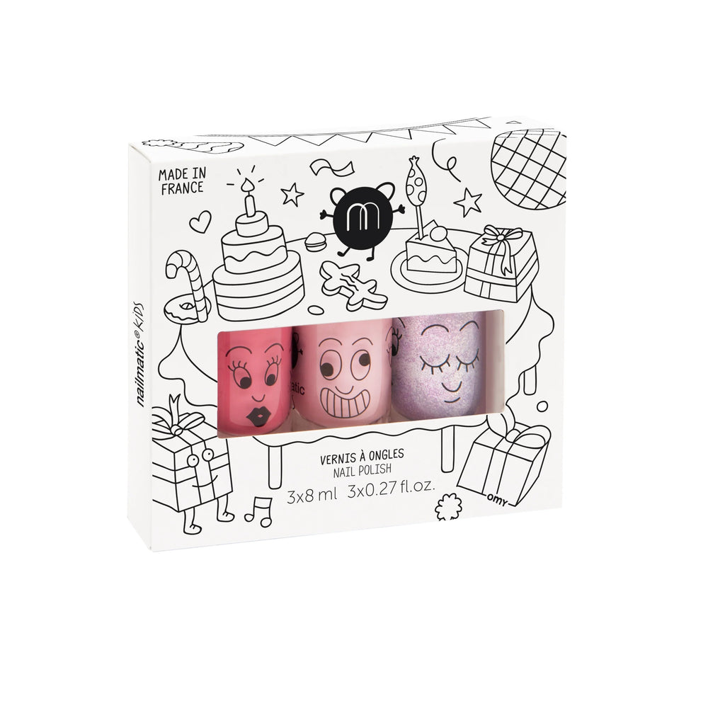 A Nailmatic - 3 Nail Polish Set - Party with cartoon faces, designed with whimsical doodles and symbols, with text indicating it is vegan cruelty-free and made in France.