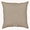 Square light brown embroidered Coral & Tusk Christmas Cheer Wreath Pillow with a small branded patch featuring a coral icon at the bottom center.
