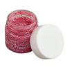 A small glass jar of pink glitter gel from the Klee Naturals Deluxe Makeup Kit - Pink Ballet Fairy with its white lid set to the side.