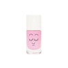 A bottle of pink Nailmatic water-based nail polish with a cute, smiling face design on the front, featuring closed eyes with long eyelashes, set against a plain white background.