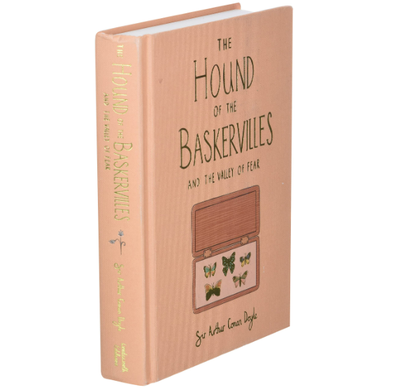 The hardcover Collector's Edition of "Hound of the Baskervilles" by Sir Arthur Conan Doyle features a box with pinned butterflies on the cover, evoking an eerie detective chiller vibe reminiscent of Sherlock Holmes' mysteries.