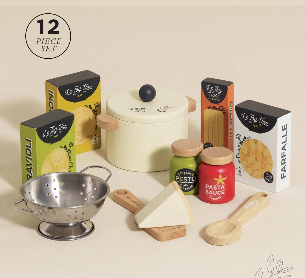 The Pretend Play Pasta Set includes 12 pieces for imaginative fun: toy pasta boxes, a pot with wooden handles, a pasta spoon, cheese wedge, jars of pesto & pasta sauce, and a small colander—ideal for young chefs' culinary adventures.