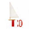 The Huckleberry Make Your Own Sailboat is a wooden DIY kit with a white sail, red keel, and a red-and-white winder with string—ideal for creating your own sailing adventure.