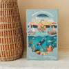 A box labeled “Ocean Explorers 40 Piece Mini” features boats with animals sailing on the water and sea creatures below, and contains a 40-piece kids jigsaw puzzle designed for ages 4 and up.