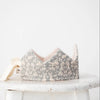 A Forest Reversible Birthday Crown featuring a delicate floral and rabbit print, displayed on a white surface against a soft white background.