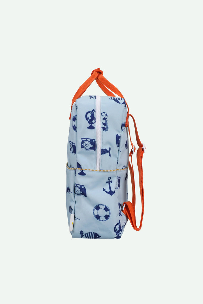 Side view of the Sticky Lemon Backpack Large - Special Edition - Wonders of the Deep Sea in light blue with orange straps, navy prints, and a handy outer pocket. Made from recycled PET bottles with a waterproof lining for durability.