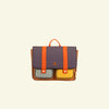 Presenting the Sticky Lemon School Bag | Better Together | Leather Ball: a rectangular satchel crafted from waterproof nylon. It features a dark purple flap, two orange buckles, and a small orange handle. The bag boasts two front pockets with grey and yellow stripes, with the initials "SL" embossed on the front. Made from recycled bottles adhering to the Global Recycled Standard, it has a plain and light-colored background.