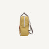 Side view of the Sticky Lemon Backpack Large - Envelope in reed green, featuring a white zipper, striped adjustable shoulder straps, and a red front pocket, displayed on a plain white background. This waterproof kids bag is thoughtfully crafted from recycled PET for durability and sustainability.