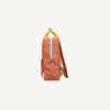 Side view of the Sticky Lemon Backpack Large - Envelope - Maple Whirl: an orange kids backpack with yellow handle and straps, white vertical stripe, side pocket, made from recycled PET bottles, set against a light background.