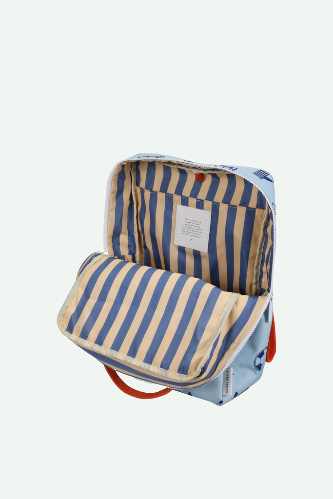 The Sticky Lemon Backpack Large – Special Edition – Wonders of the Deep Sea features a light blue exterior with subtle designs, a red handle, and an open view showing blue and beige vertical striped waterproof lining. Made from recycled PET bottles.